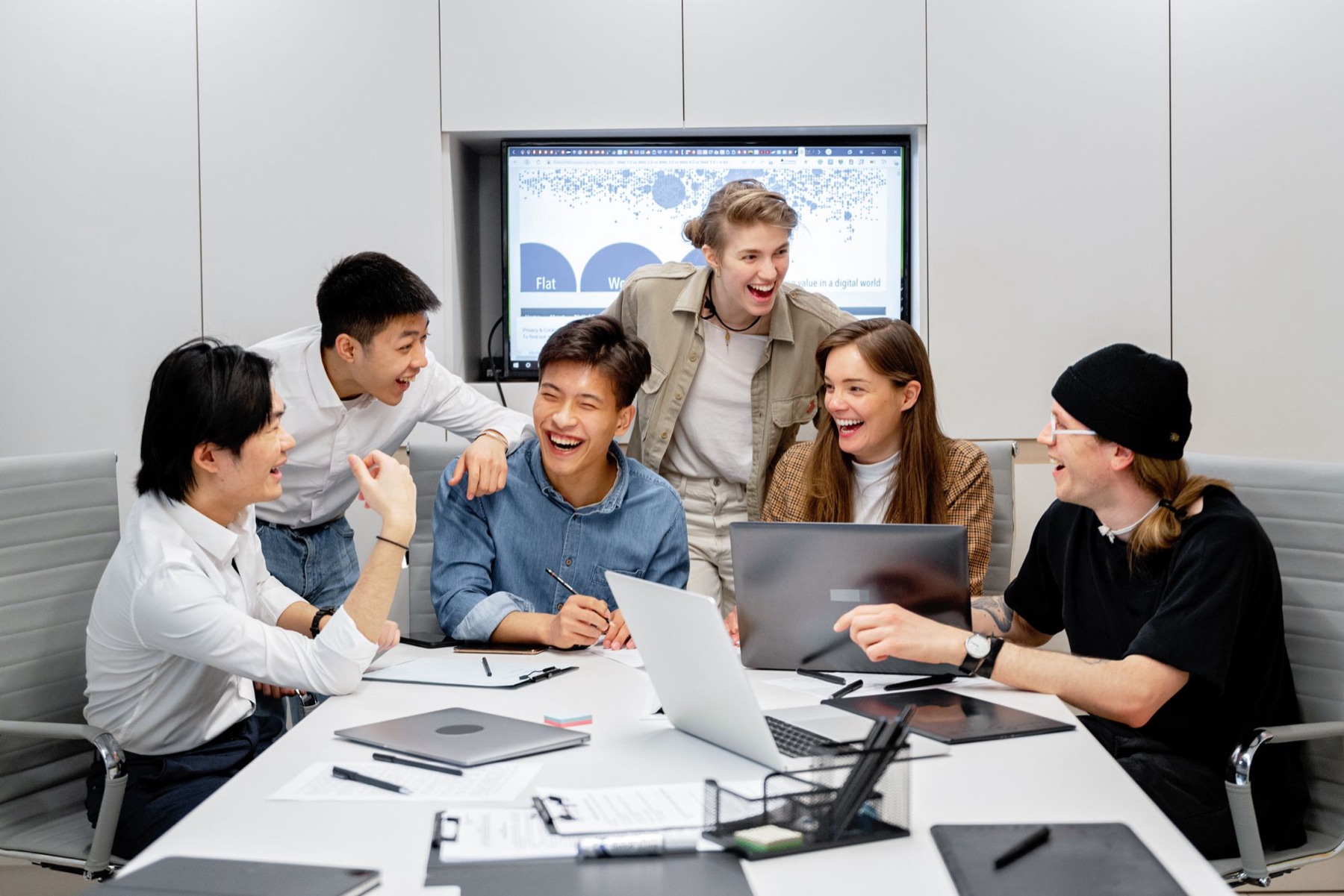 A team working together around an office table